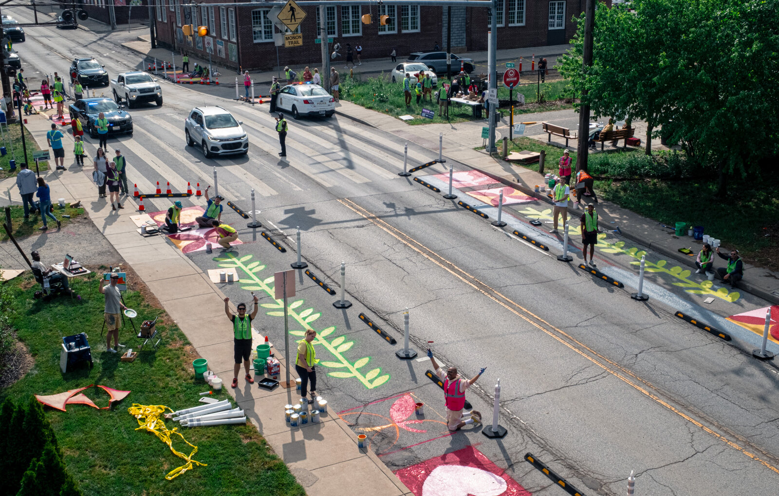 Neighbors painting and installing the 16th and Monon crossing from above