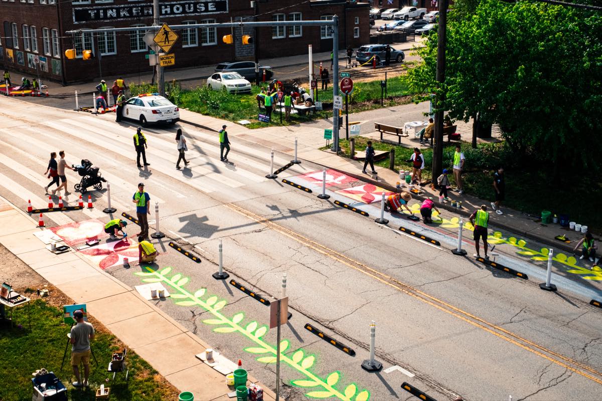 Aerial view of volunteers painting all four quadrants of the 16th Street and Monon Trail crossing during the April 25 build.
